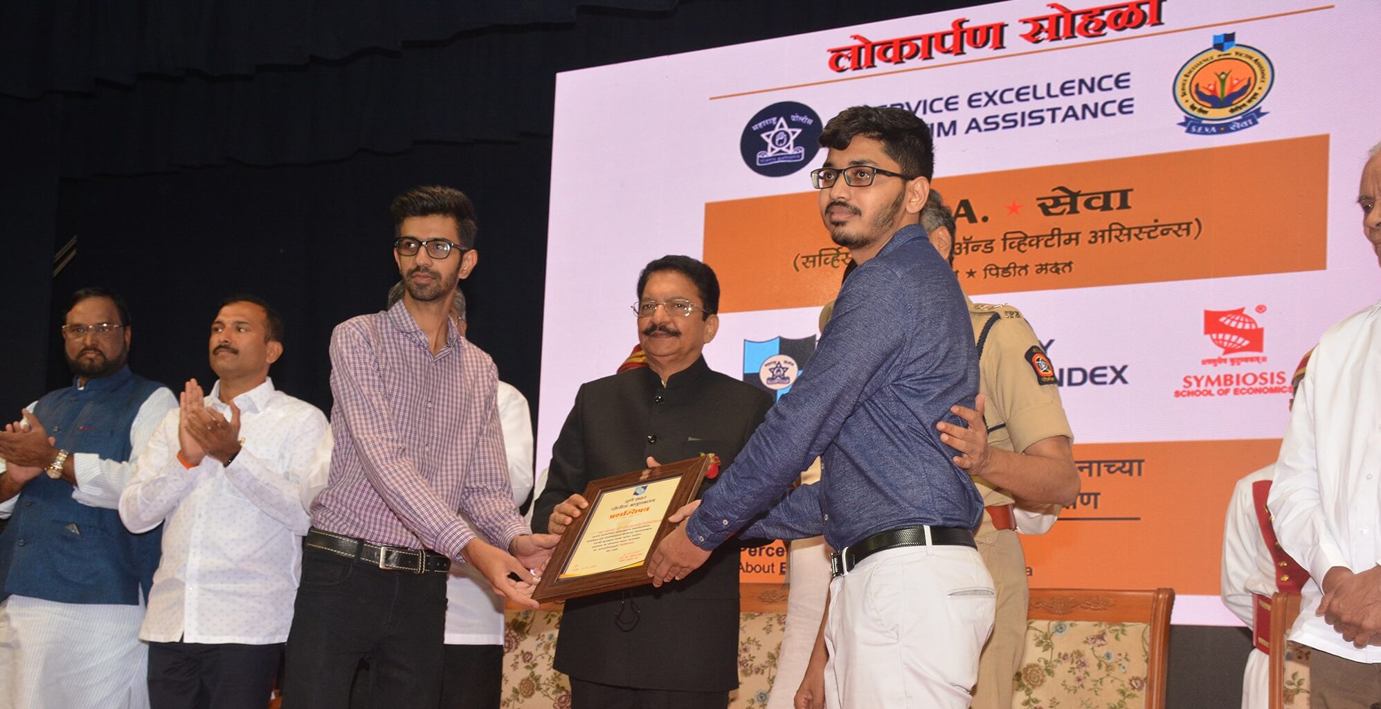 Adivid Technologies receiving award from Governor